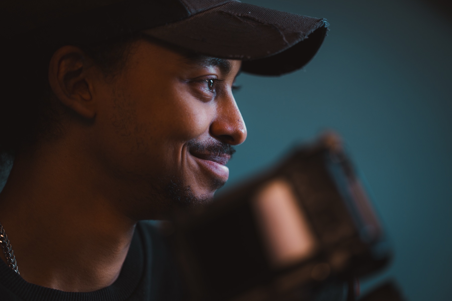 Joel Tesfai in the studio with lighting equipment