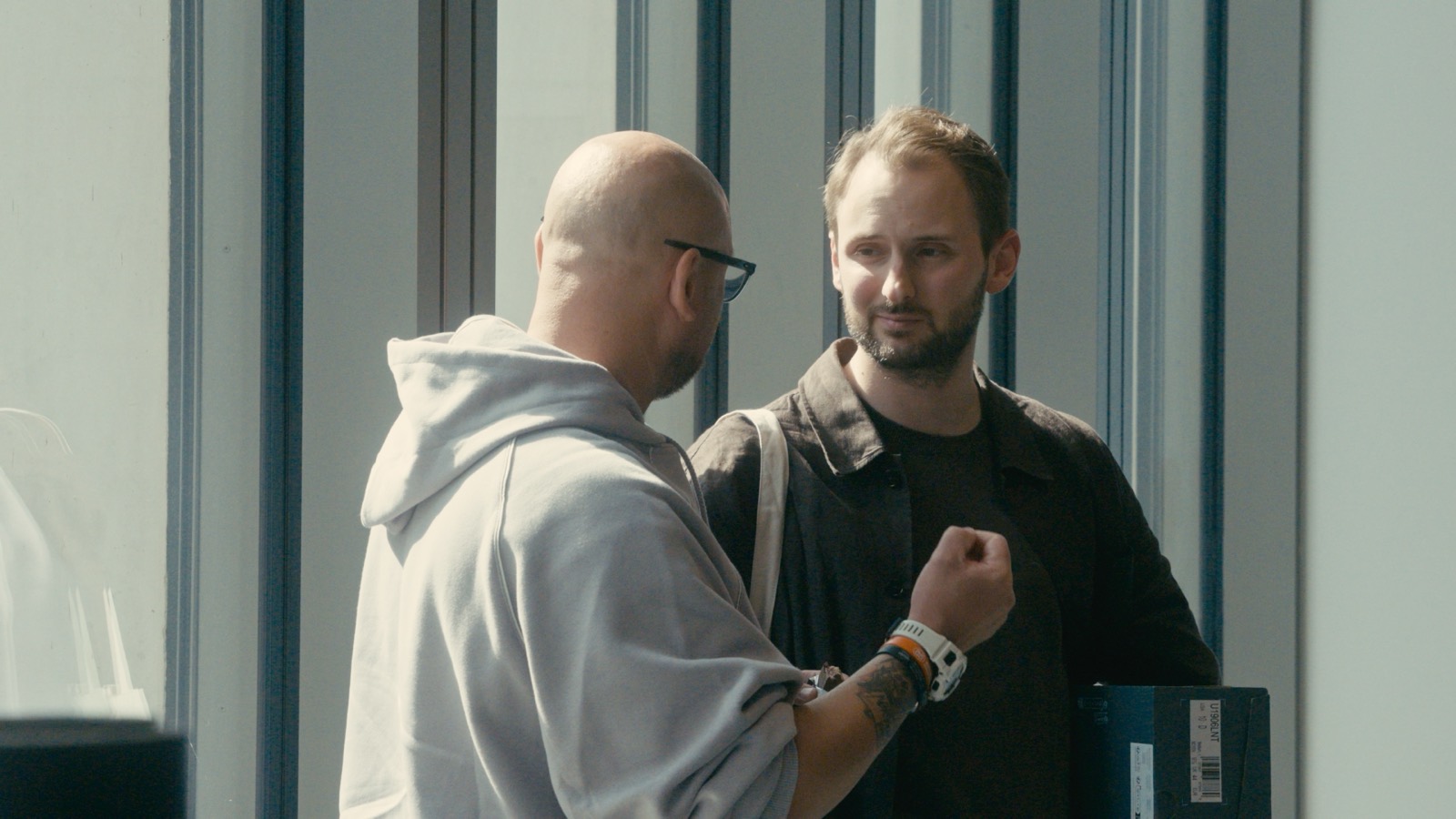 Two guests in conversation at the International OPS Meeting